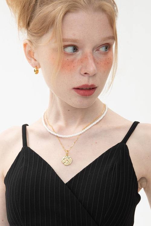 Set aus Skulpturaler Goldhalskette mit Sternzeichen-Anhänger
